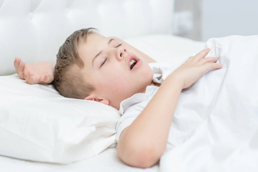 Child Snoring on bed
